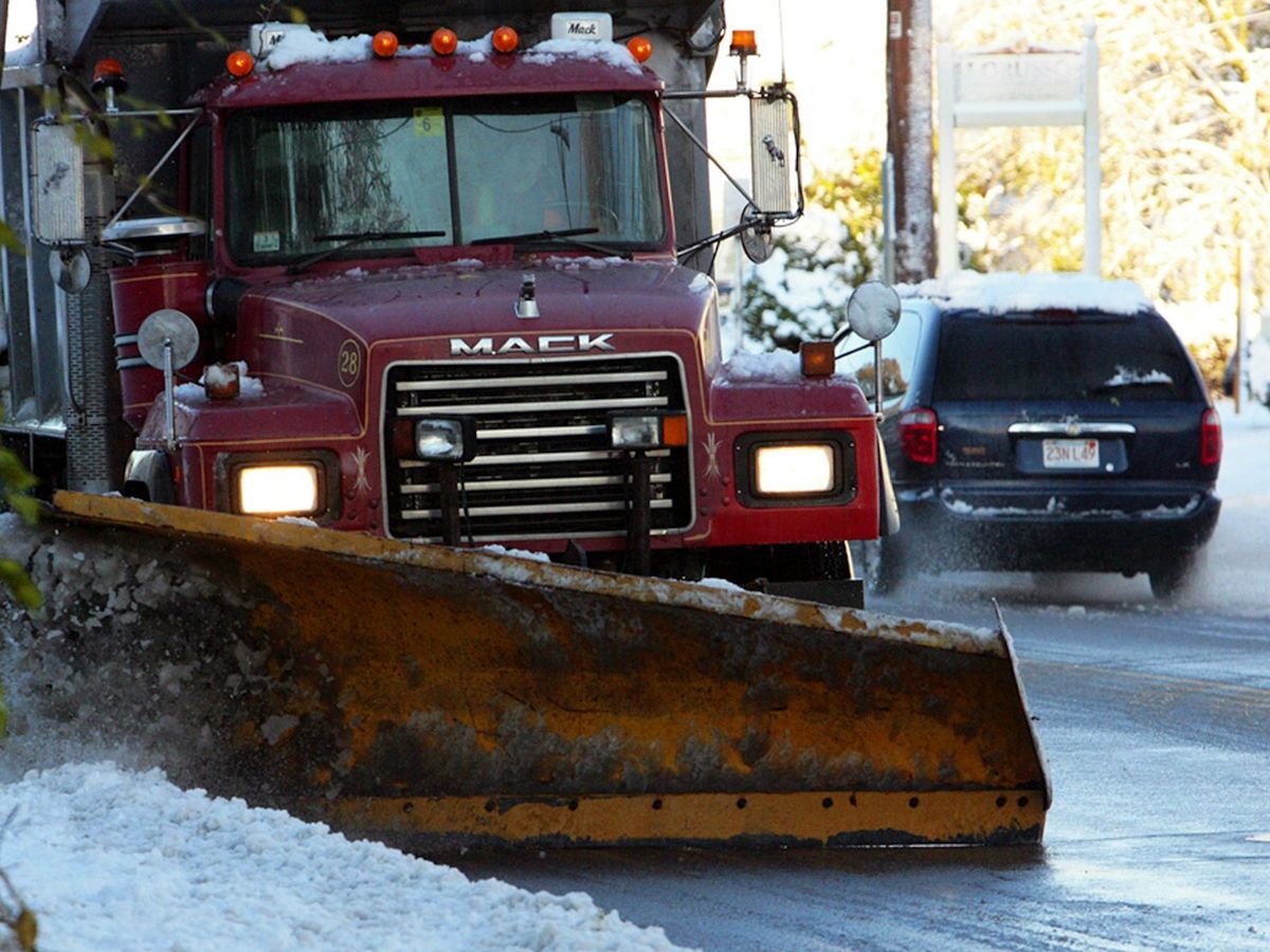 Plow truck clearing a snowy road