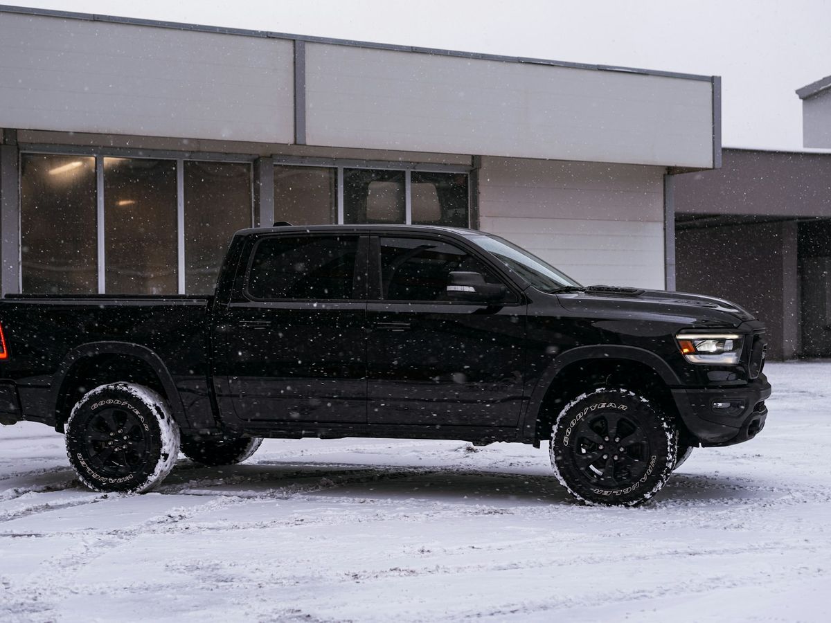 Pickup truck parked in falling snow