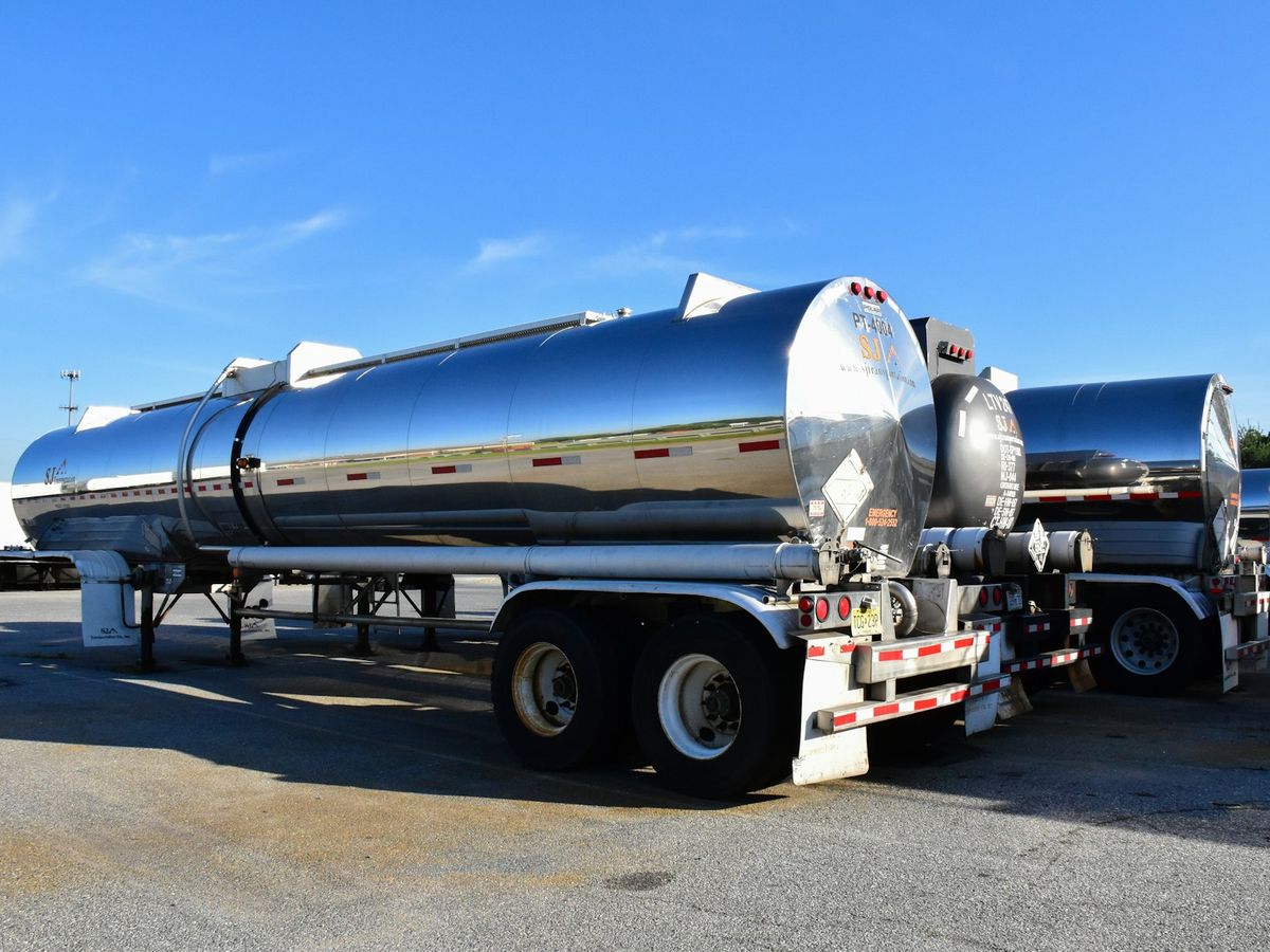 Stainless tanker trailers parked in a yard